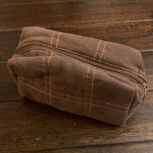 Darphin Paris Brown Velvety Toiletry Bag with orange lining